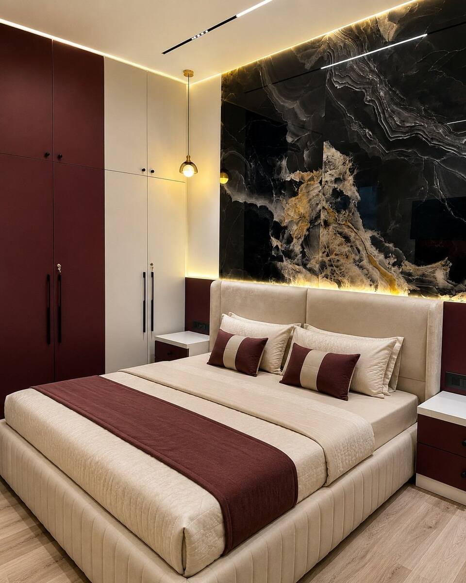 Abhilash Residence bedroom with burgundy wardrobe and marble accent wall