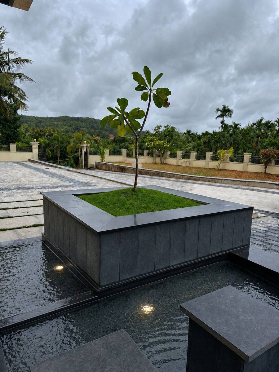 Abhilash Residence courtyard water feature with granite planter