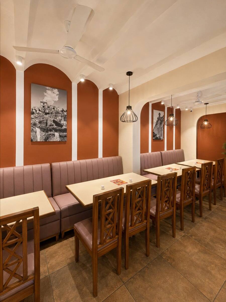 Charminar Restaurant seating beneath arched terracotta alcoves