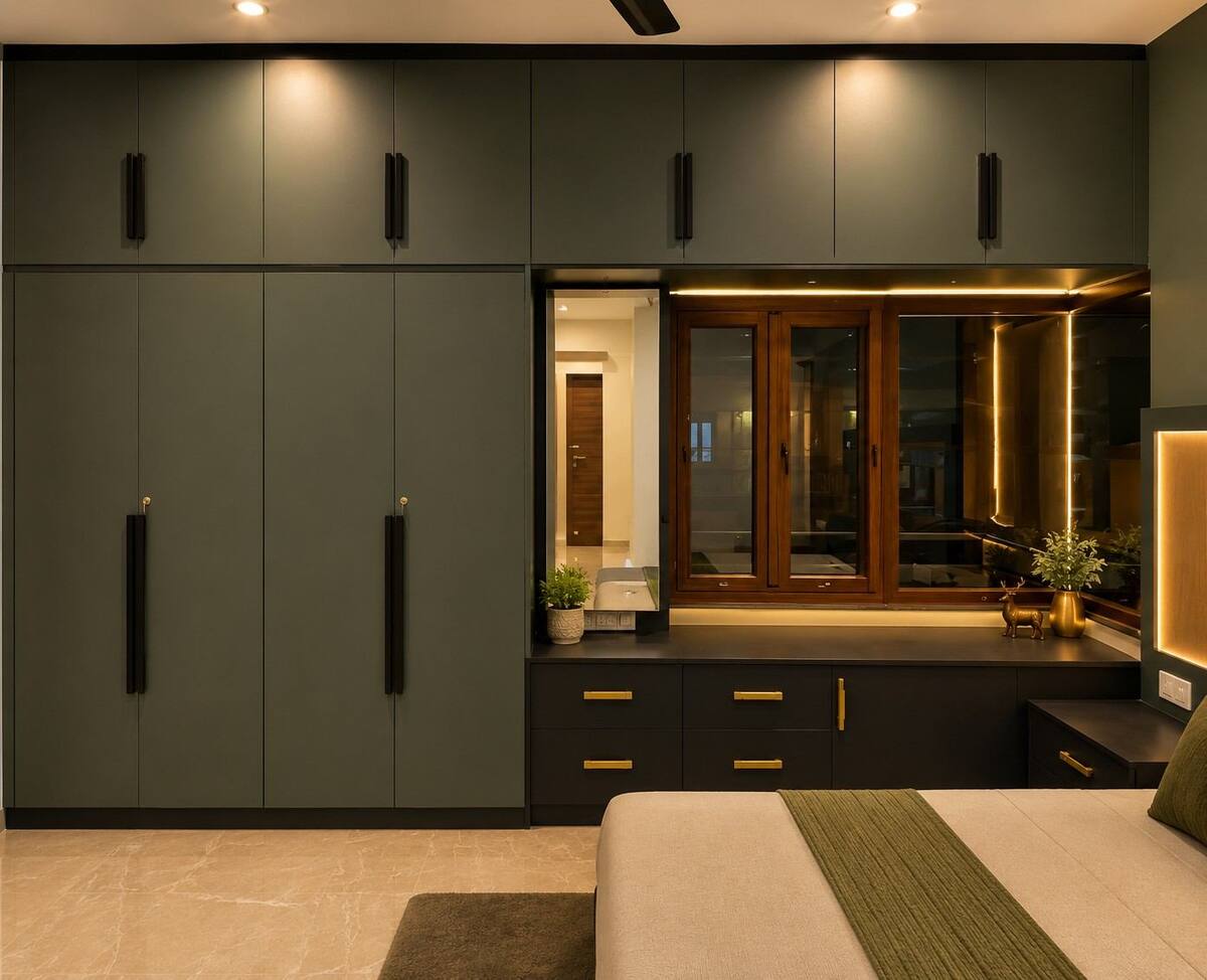 Chikappa Residence bedroom with olive-green wardrobe and brass handles