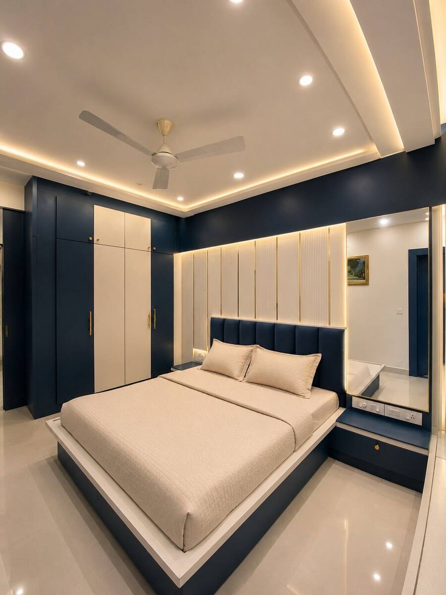Ivory Towers bedroom with navy blue wardrobe and bed