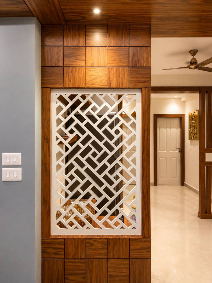 Pinnacle Castle CNC-cut jali partition detail beside the entrance hallway